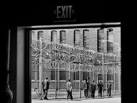 Inmates walk back to their cells after enjoying some outside time.  The Bristol County Jail and House of Correction on Ash St. in New Bedford, MA was built in 1829 and is the oldest operating jail in the country.  Almost all of the inmates at the jail are awaiting trial date.  Eighteen of the inmates have been sentenced and are active in the maintenance of the facility.