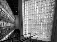 An inmate leaves the door into the courtyard passing the huge glass block wall that lets most of the light into the facility.   The Bristol County Jail and House of Correction on Ash St. in New Bedford, MA was built in 1829 and is the oldest operating jail in the country.  Almost all of the inmates at the jail are awaiting trial date.  Eighteen of the inmates have been sentenced and are active in the maintenance of the facility.