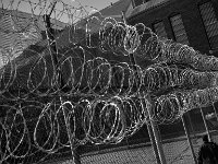 An inmate walks back to his cell after having lunch.  The Bristol County Jail and House of Correction on Ash St. in New Bedford, MA was built in 1829 and is the oldest operating jail in the country.  Almost all of the inmates at the jail are awaiting trial date.  Eighteen of the inmates have been sentenced and are active in the maintenance of the facility.