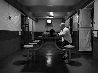 Paul Dupras who is serving a 1 year sentence for parole violation watches television in the common area of section for inmates serving time.  The Bristol County Jail and House of Correction on Ash St. in New Bedford, MA was built in 1829 and is the oldest operating jail in the country.  Almost all of the inmates at the jail are awaiting trial date.  Eighteen of the inmates have been sentenced and are active in the maintenance of the facility.