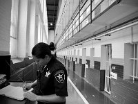 Lt Christine Botelho fills in the log book as she prepares to do lockk down.  The Bristol County Jail and House of Correction on Ash St. in New Bedford, MA was built in 1829 and is the oldest operating jail in the country.  Almost all of the inmates at the jail are awaiting trial date.  Eighteen of the inmates have been sentenced and are active in the maintenance of the facility.