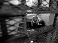 Robert Potvin reads a book after lockdown in his cell.  Mr Potvin will be in the jail for a totalof 15 months after being sentenced.  The Bristol County Jail and House of Correction on Ash St. in New Bedford, MA was built in 1829 and is the oldest operating jail in the country.  Almost all of the inmates at the jail are awaiting trial date.  Eighteen of the inmates have been sentenced and are active in the maintenance of the facility.