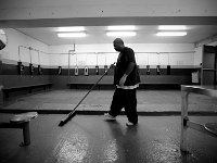 Quinones Edwin sweeps the recreation room where inmates work out or make phone calls.  The Bristol County Jail and House of Correction on Ash St. in New Bedford, MA was built in 1829 and is the oldest operating jail in the country.  Almost all of the inmates at the jail are awaiting trial date.  Eighteen of the inmates have been sentenced and are active in the maintenance of the facility.