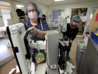 Nurses in the ICU at St. Luke's Hospital in New Bedford, clean a computer workstation.  PHOTO PETER PEREIRA