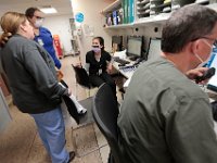 Nurses confer with each other at the nurse station in the CCU at St. Luke's Hospital in New Bedford.  PHOTO PETER PEREIRA