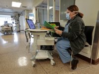 Donor services nurse, Kathy Carry, is stationed outside one of the sealed rooms in the ICU at St. Luke's Hospital in New Bedford.  PHOTO PETER PEREIRA