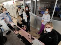 Maria Tassoni, center, Critical Care Units Nurse Manager, works with her nurses in the ICU at St. Luke's Hospital in New Bedford.   PHOTO PETER PEREIRA