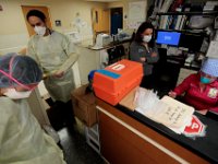 Emergency Room nurses get ready to see a walk-in patient as others are seen at the nurse desk at St. Luke's Hospital in New Bedford.  PHOTO PETER PEREIRA