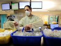 A nurse picks items from the IV supplies at the ER nurses station at St. Luke's Hospital in New Bedford.  PHOTO PETER PEREIRA