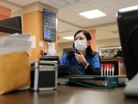 A nurse keeps her eyes on the metrics of a patient in the Knowles Wing at St. Luke's Hospital in New Bedford.  PHOTO PETER PEREIRA