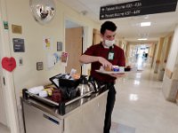Adam Foley, food ambassador, prepares a meal for a patient at St. Luke's Hospital in New Bedford.  PHOTO PETER PEREIRA