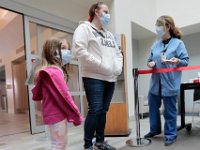 Jessica Waite and her daughter Molly waite, 5, walk into the main entrance to St. Luke's Hospital in New Bedford.  PHOTO PETER PEREIRA