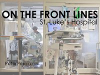 Dr. Michael Barretti, checks in on a COVID-19 patient in critical condition inside one of the sealed rooms of the St. Luke's Hospital ICU in New Bedford, MA. PHOTO PETER PEREIRA