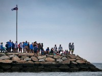 People watch the XII International Azorean Whaleboat Regatta rowing takes place in Clarke's Cove in New Bedford after a six year hiatus.