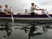 Women from the Azorean island of Pico paddle to the start line for the XII International Azorean Whaleboat Regatta which took place in Clarke's Cove in New Bedford after a six year hiatus.