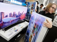 Joseph Rebelo grabs the television he waited in line for as he and fellow shoppers look for the best deals at Best Buy in Dartmouth, MA on Black Friday November 25, 2016.  PETER PEREIRA/THE STANDARD-TIMES/SCMG : shopping, shop, black friday, madness, economy, holiday, season