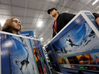 Joseph Rebelo and Jeff Raposo grab the television sets they waited in line for as they and fellow shoppers look for the best deals at Best Buy in Dartmouth, MA on Black Friday November 25, 2016.  PETER PEREIRA/THE STANDARD-TIMES/SCMG : shopping, shop, black friday, madness, economy, holiday, season