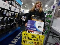 Sandy Costeira has her hands full with purchases as she makes her way through Best Buy in Dartmouth, MA on Black Friday November 25, 2016.  PETER PEREIRA/THE STANDARD-TIMES/SCMG : shopping, shop, black friday, madness, economy, holiday, season