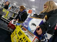 Shoppers have their hands full as they try to grab the best deals at Best Buy in Dartmouth, MA on Black Friday November 25, 2016.  PETER PEREIRA/THE STANDARD-TIMES/SCMG : shopping, shop, black friday, madness, economy, holiday, season