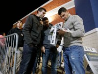 Shoppers take a peek at the sale flier as they wait for doors to open on Black Friday at Best Buy in Dartmouth, MA on November 25, 2016.  PETER PEREIRA/THE STANDARD-TIMES/SCMG : shopping, shop, black friday, madness, economy, holiday, season