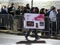 A shopper walks with purchase in hand as others wait for their chance to shop for deals at Best Buy in Dartmouth, MA on November 25, 2016.  PETER PEREIRA/THE STANDARD-TIMES/SCMG : shopping, shop, black friday, madness, economy, holiday, season