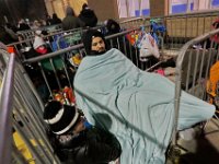 Noah Pimental and fellow shoppers try to stay warm as they wait for the doors to Walmart to open at 1am on Black Friday in Dartmouth, MA.  [ PETER PEREIRA/THE STANDARD-TIMES/SCMG ]