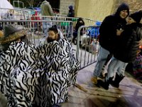 Shoppers try to stay warm as they wait for the Walmart doors to open at 1am on Black Friday in Dartmouth, MA.  [ PETER PEREIRA/THE STANDARD-TIMES/SCMG ]