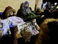 Shoppers try to stay warm as they wait for the Walmart doors to open at 1am on Black Friday in Dartmouth, MA.  [ PETER PEREIRA/THE STANDARD-TIMES/SCMG ]