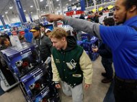 Shoppers rush into Best Buy as doors open at 1am on Black Friday in Dartmouth, MA.  [ PETER PEREIRA/THE STANDARD-TIMES/SCMG ]