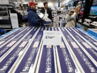 Shoppers look to take advantage of the deals available at Best Buy after doors opened at 1am on Black Friday in Dartmouth, MA.  [ PETER PEREIRA/THE STANDARD-TIMES/SCMG ]