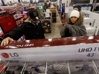 Shoppers look to take advantage of the deals available at Best Buy after doors opened at 1am on Black Friday in Dartmouth, MA.  [ PETER PEREIRA/THE STANDARD-TIMES/SCMG ]