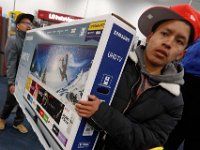 Shoppers wait to cash out on their purchases at Best Buy on Black Friday in Dartmouth, MA on November 24, 2017.  [ PETER PEREIRA/THE STANDARD-TIMES/SCMG ]