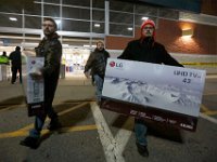 Shoppers wait to cash out on their purchases at Best Buy on Black Friday in Dartmouth, MA.  [ PETER PEREIRA/THE STANDARD-TIMES/SCMG ]