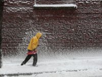 A man clears the sidewalk on Elm Street in downtown New Bedford.  .  [ PETER PEREIRA/THE STANDARD-TIMES/SCMG ]