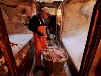 1007935253 ma nb Fishing  Lumper Steve lacomb is seen below deck filling the baskets with fish as he and the crew of the fishing boat United States unload their catch at Bergie's Seafood in New Bedford.   PETER PEREIRA/THE STANDARD-TIMES/SCMG : fishing, waterfront, fisherman, boat, catch, fish