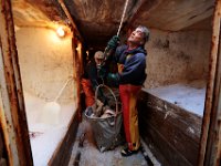 1007935253 ma nb Fishing  Lumper, Chris Silva, prepares to send up a basket of cod as he and the crew of the fishing boat United States unload their catch at Bergie's Seafood in New Bedford.   PETER PEREIRA/THE STANDARD-TIMES/SCMG : fishing, waterfront, fisherman, boat, catch, fish