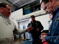1007935253 ma nb Fishing  Bergie's Seafood owner Mark Bergeron and the captain of the fishing boat United States, Antonio Cravo, check the figures of how much fish has been unloaded.     PETER PEREIRA/THE STANDARD-TIMES/SCMG : fishing, waterfront, fisherman, boat, catch, fish