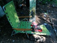ma nb HomelessinTheWoods  Michael Marques is reflected on a mirror that sits next to a lawn chair in the area he lives in the woods behind Save-A-Lot in the north end of New Bedford.  PETER PEREIRA/THE STANDARD-TIMES : poverty, homeless, woods