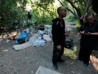 ma nb HomelessinTheWoods  Michael Marques and girlfriend Maria Keplar walk toward the area they live in the woods/  A homeless village has popped up in the woods behind Save-A-Lot in the north end of New Bedford.  PETER PEREIRA/THE STANDARD-TIMES : poverty, homeless, woods