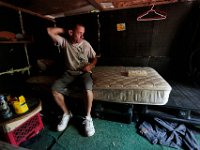 ma nb HomelessinTheWoods  James Soares is seen inside the home he has made from crates in the woods behind Save-A-Lot in the north end of New Bedford.  PETER PEREIRA/THE STANDARD-TIMES : poverty, homeless, woods