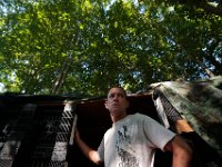ma nb HomelessinTheWoods  James Soares, 50, walks out of the room he made using crates in the woods behind Save-A-Lot in the north end of New Bedford.  PETER PEREIRA/THE STANDARD-TIMES : poverty, homeless, woods