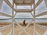 New Bedford lifeguards monitoring the south end beaches go through their morning ritual of stretching, running, swimming and putting out the signs, before monitoring the beaches, as swimming season officially begins.   [ PETER PEREIRA/THE STANDARD-TIMES/SCMG ]