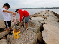 New Bedford lifeguards monitoring the south end beaches go through their morning ritual of stretching, running, swimming and putting out the signs, before monitoring the beaches, as swimming season officially begins.   [ PETER PEREIRA/THE STANDARD-TIMES/SCMG ]