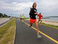 New Bedford lifeguards monitoring the south end beaches go through their morning ritual of stretching, running, swimming and putting out the signs, before monitoring the beaches, as swimming season officially begins.   [ PETER PEREIRA/THE STANDARD-TIMES/SCMG ]