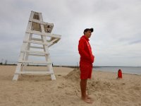 New Bedford lifeguards monitoring the south end beaches go through their morning ritual of stretching, running, swimming and putting out the signs, before monitoring the beaches, as swimming season officially begins.   [ PETER PEREIRA/THE STANDARD-TIMES/SCMG ]