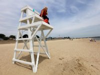 New Bedford lifeguards monitoring the south end beaches go through their morning ritual of stretching, running, swimming and putting out the signs, before monitoring the beaches, as swimming season officially begins.   [ PETER PEREIRA/THE STANDARD-TIMES/SCMG ]