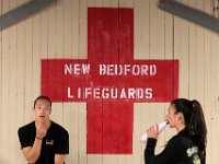 New Bedford lifeguards monitoring the south end beaches go through their morning ritual of stretching, running, swimming and putting out the signs, before monitoring the beaches, as swimming season officially begins.   [ PETER PEREIRA/THE STANDARD-TIMES/SCMG ]