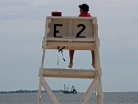 New Bedford lifeguards monitoring the south end beaches go through their morning ritual of stretching, running, swimming and putting out the signs, before monitoring the beaches, as swimming season officially begins.   [ PETER PEREIRA/THE STANDARD-TIMES/SCMG ]