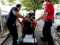 New Bedford EMS crew responds to a man complaining about having difficulty breathing.  Despite over 12,000 COVID-19 related calls since March, only one part-time EMT has tested positive for the virus.   PHOTO PETER PEREIRA