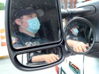 New Bedford EMT Rick Kalisz waits for the call in the drivers seat of a New Bedford EMS ambulance.  PHOTO PETER PEREIRA